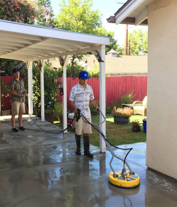 Big Wave service professionals performing flat surface concrete cleaning
