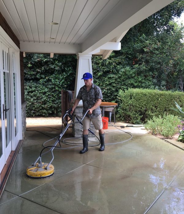 A Big Wave service professional performing flat surface concrete cleaning